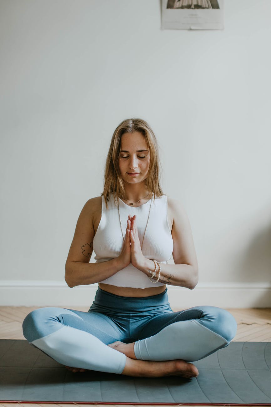 woman doing yoga inside a room