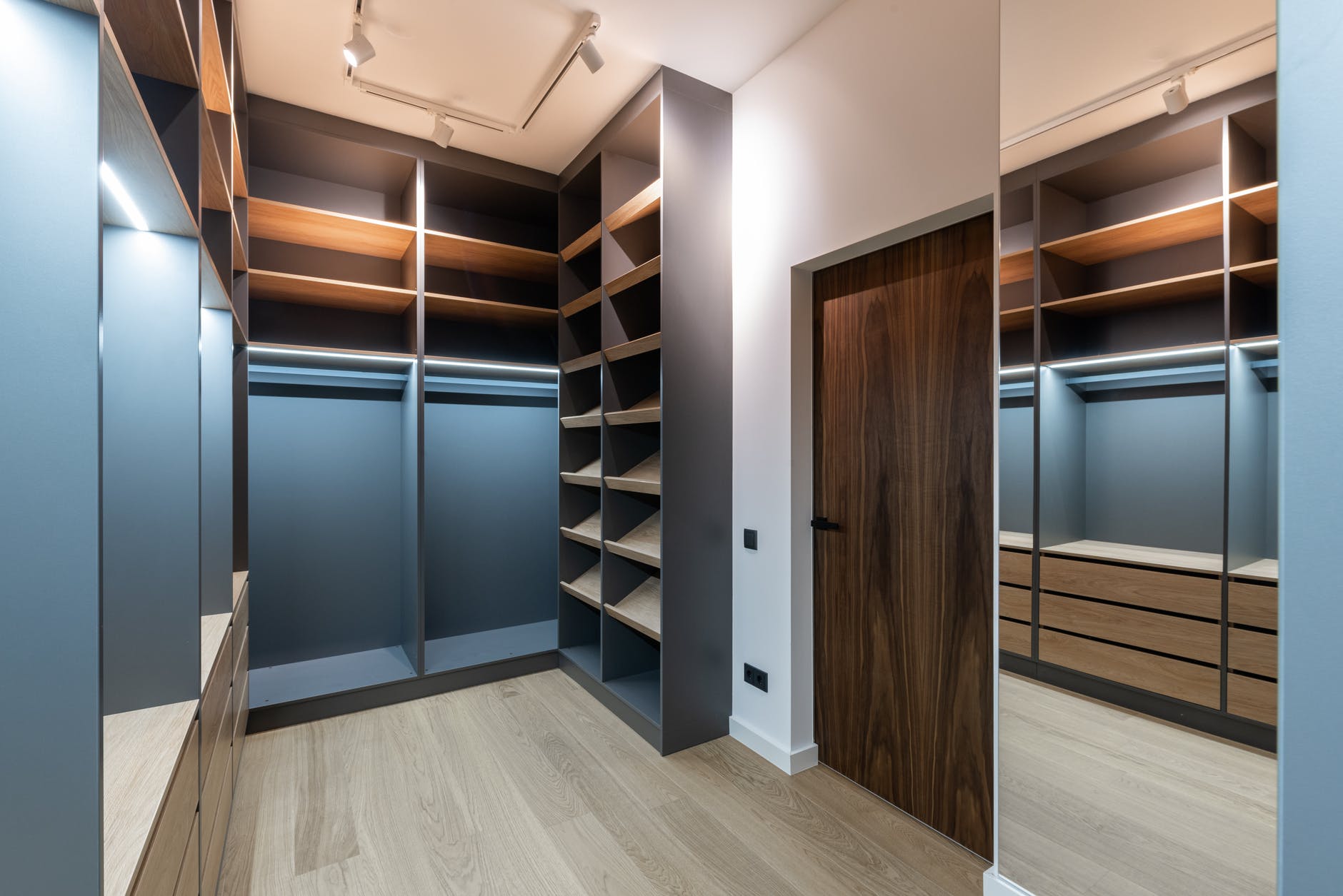 wardrobe interior with shelves near door